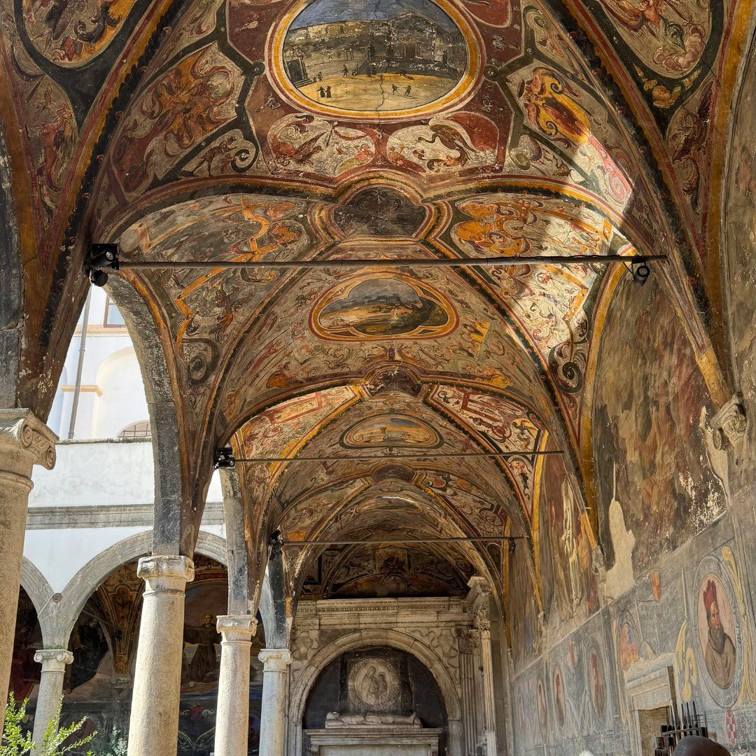 Frescoed vaulted cloister ceiling in a church of the Naples historic center