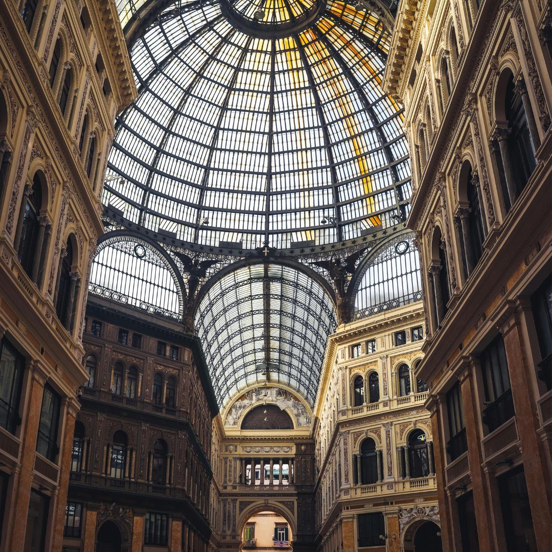 Ornate glass and iron dome of the Galleria Umberto I shopping arcade in Naples